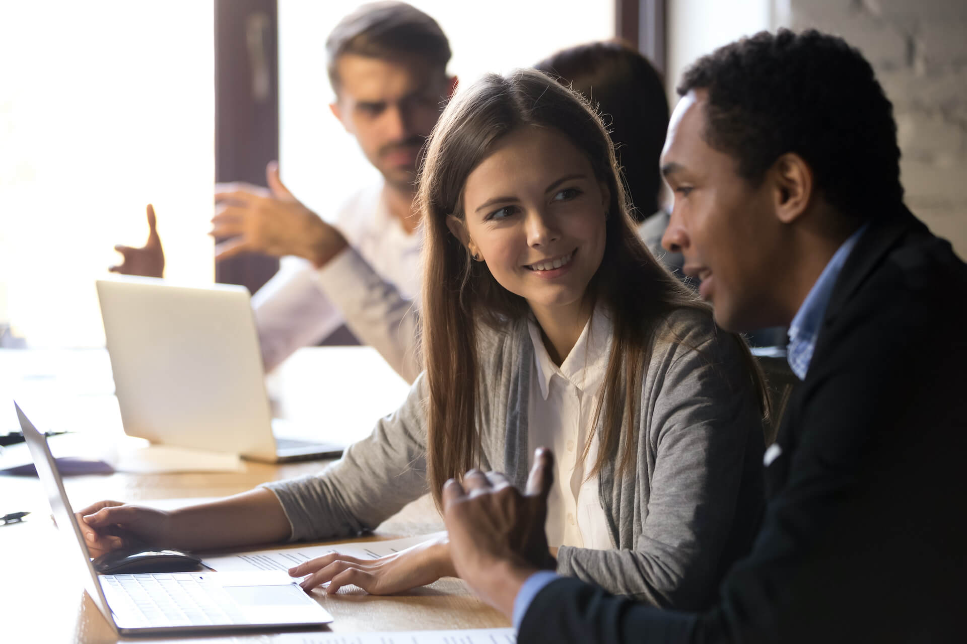 stock image of two people at a computer